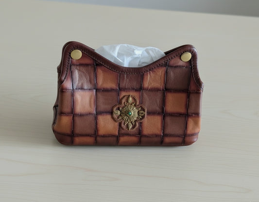 Embroidered tissue dispenser
